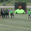 Vincenzo Riccio del Budoni festeggiato dai compagni dopo il gol