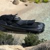Cala Coticcio, yacht, moto d'acqua e sirene