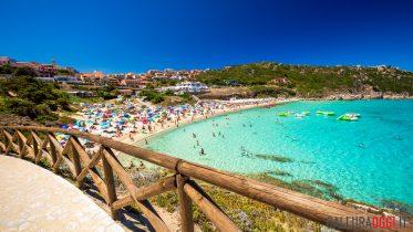 Spiaggia di Rena Bianca beach with red rocks and azure clear water, Santa Terasa Gallura, Costa Smeralda, Sardinia, Italy